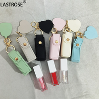 Huile à lèvres repulpante hydratante transparente végane en tube transparent avec miroir, porte-clés et étui en cuir PU pour brillant à lèvres