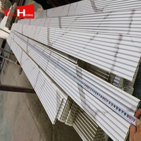 Panneau de revêtement intérieur en plastique composite en bois Décoration de lambris Revêtement cannelé 3D Panneau mural en PVC WPC