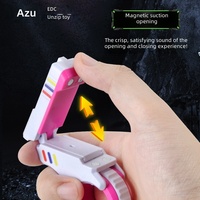Bestseller transfrontalier A-ZU SE Pistolet de décompression multifonctionnel anti-stress en plastique avec jeu de pousser les cartes et fixation magnétique