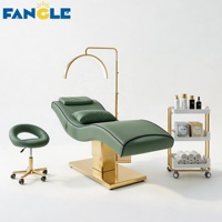 Nouveau style : Ensemble lit de soin et chariot à base dorée, lit SPA vert haut de gamme pour centre de bien-être féminin, table de massage électrique réglable