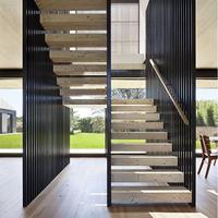 Escalier flottant sur mesure pour rénovation intérieure avec supports dissimulés et marches en bois naturel
