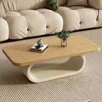 Table basse sculpturale à base ovale en bois massif avec rangement central creux pour salon, table basse moderne