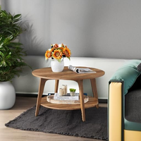Table basse ronde à 2 niveaux avec rangement, pieds effilés, transitions courbes, montage facile, pour salon