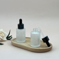 Flacon compte-gouttes en verre dépoli de 30 ml (1 oz), contenant rond à épaule plate pour sérum et huile essentielle, emballage élégant pour soins de la peau avec logo personnalisé