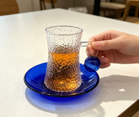 Ensemble de tasses à café classiques en verre borosilicate texturé, forme sablier, avec poignée boule bleue, 120 ml, et soucoupe à thé