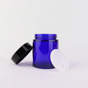 Nhà Máy Giá Sang Trọng Vòng Màu Xanh Thủy Tinh Kem Jar 100G Mỹ Phẩm <span class=keywords><strong>Container</strong></span> Với Nắp Màu Đen Chất Lượng Chai Thủy Tinh - Product Image 1