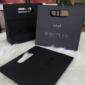 Bolsa de Compras de Papel con Asa Troquelada de Lujo, Bolsa de Regalo de Cartón Negro Mate con Logotipo Personalizado para Boutique, Cosméticos, Joyería, Ropa - Product Image 1