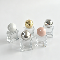 Flacon de parfum 18 ml en verre sérigraphié artistique en forme d'étoile, avec pulvérisateur à brume fine, bouchon sphérique en verre silex et pompe en carton