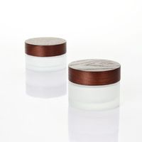 Ventas calientes Ash Tree Tapa de aerosol de madera Tapa de bambú Botellas de bomba de vidrio cosmético para cosméticos