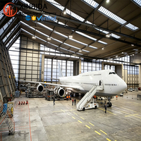 Hangar d'avion en acier robuste à portée libre, espace intérieur sans colonnes pour révision d'avions de grande taille, performance structurelle fiable