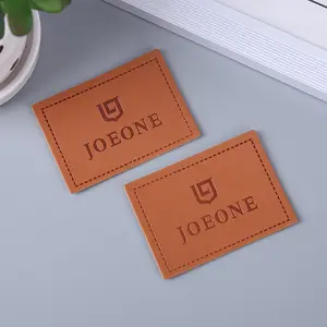 17 Anos Personalizado LOGOTIPO Hat Patch de couro PU Soft Debossed Stamp Etiqueta De Couro Dobrável Para Roupas Jeans Vestuário