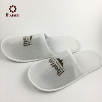 Pantoufles blanches jetables de tissu de sieste pour l'hôtel