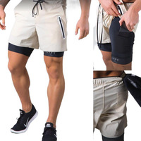 Short d'entraînement OEM 2 en 1 pour hommes Tissu respirant Short de course décontracté Double couche Short de surf de plage