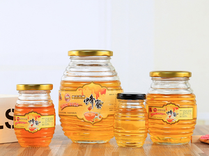 Vente en gros de 100ml 180ml 350ml 730ml 250 ml 500g 1000g Pots vides en verre de miel en forme d'abeille avec joint à bouchon à vis - Product Image 6