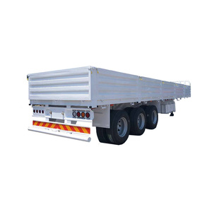 Semi-remorque plateau robuste 28T pour matériel lourd, avec flancs en acier, 3 essieux, dimensions 7600+1310+1310 mm - Product Image 1