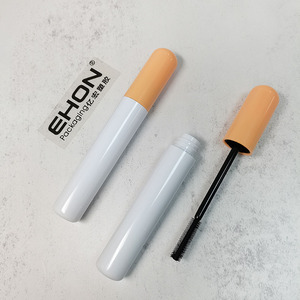 Vente en gros de contenants de mascara cylindriques brillants en ABS/PETG avec couvercle orange, tube à cils vide, emballage cosmétique personnalisé - Product Image 1