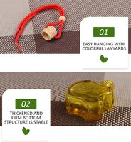 Vente en gros Rafraîchisseur d'air suspendu pour voiture Diffuseur de parfum pour voiture Emballage en carte blister Bouteille en verre colorée de 8ml avec bouchon en bois