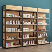 Étagère de présentation de vêtements en or sur mesure, en fer, à plusieurs niveaux, boutique moderne