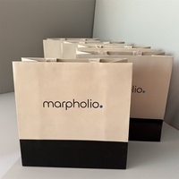 Sacs en papier texturé de luxe avec logo personnalisé et poignée en ruban pour le shopping, l'emballage et les expositions