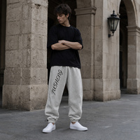 Pantalon de jogging ample pour homme, taille élastique, cordon de serrage, bord côtelé intérieur, style streetwear, personnalisable OEM
