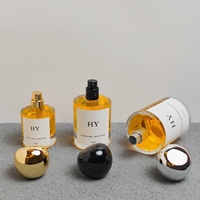Flacon vaporisateur de parfum en verre cylindrique minimaliste 30ml 50ml 100ml personnalisable avec bouchon en forme de pierre