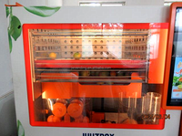 Distributeurs automatiques de boissons à base de jus de fruits orange 24 h/24 Tous peuvent être équipés de lecteurs de cartes de crédit Garantie