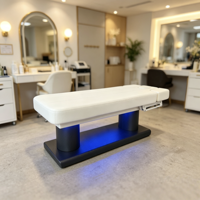Lit de beauté et table de massage électrique de luxe à 4 moteurs pour salons de beauté, en cuir noir, pour soins du visage et extensions de cils