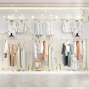 Customized Gold Stainless Steel Boutique Display Stand Clothing Hanging Rack Shelf Garment Store Interior Design
