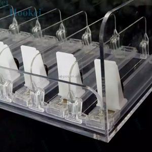 Réfrigérateur automatique en plastique à ressort de supermarché avec système de glisse à rouleaux pour la gestion de l'eau, pousseur de bouteilles de boissons et d'étagères - Product Image 1