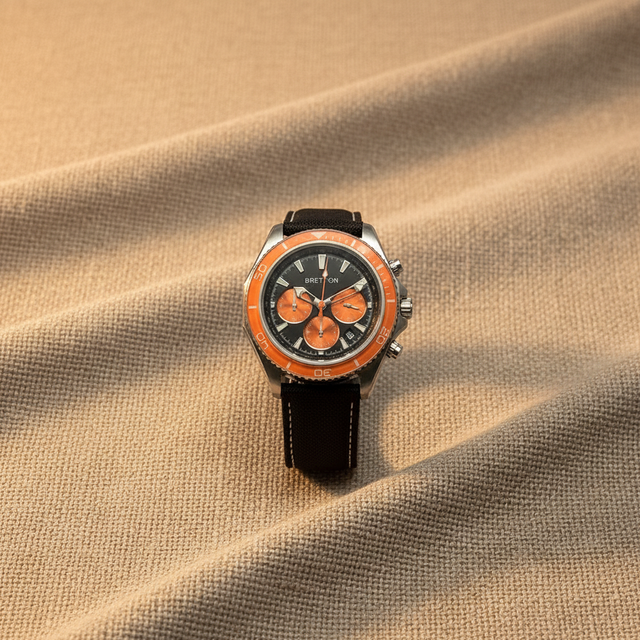 Stainless Steel Chronograph Watch with Black Dial Orange Sub Dials Orange Bezel and White Stitched Black Canvas Band