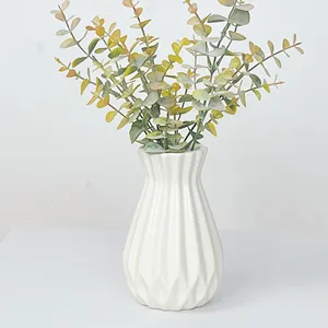 Einfache klassische nordische moderne Donut stehende Blumentopf-Keramikvase mit künstlichen Pflanzen für Heimdekoration