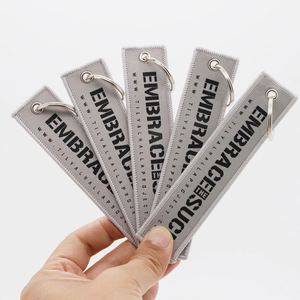 Porte-clés Jet Tag personnalisé avec logo et message de motivation, pour marques lifestyle, articles de collecte de fonds pour organisations non-profit, étiquettes de vol - Product Image 3