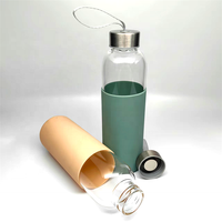 Nouvelle conception de bouteille d'eau en verre portable de qualité supérieure avec manchon en silicone et bouchon en acier inoxydable