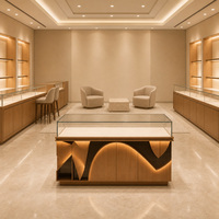 Vitrine de présentation de montres et bijoux sur mesure, cadre doré, façade en verre, éclairage LED pour magasin de détail et distributeur en gros