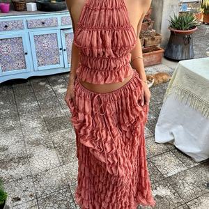 ชุดเซ็ต 2 ชิ้นสุดฮิตสำหรับผู้หญิง ดีไซน์เก๋ไก๋ แต่งระบายจับจีบ คอสูงผูกหลัง โชว์หลัง เซ็กซี่ ท็อปครอป กระโปรงยาวเอวต่ำ - Product Image 1