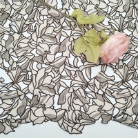 Tissu en dentelle brodé au laser à deux couleurs, motif feuille, de haute qualité, en stock usine, à prix abordable, pour vêtements, échantillon gratuit disponible
