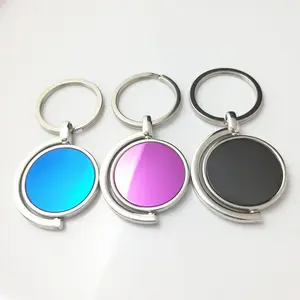 Vente en gros de porte-clés en métal en alliage de zinc rond blanc porte-clés rotatif avec logo personnalisable porte-clés promotionnel
