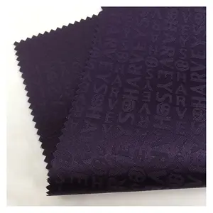 custom logo PU coating 100% polyester matte satin jacquard lining fabric for bag