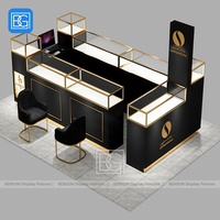 Comptoir de parfum en verre Armoire de présentation verrouillable avec cadre en acier inoxydable Support de parfum d'accent doré Meubles de magasin de détail