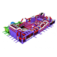 Structure gonflable commerciale pour enfants et adultes, avec toboggan, parcours d'obstacles et aire de jeux combinée, thème parc d'attractions, pour location événementielle