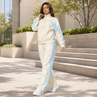 Ensemble coordonné décontracté pour femme en polyester avec sweat-shirt à col montant zippé et blocs de couleur contrastés, tenue 2 pièces pour femme, vente en gros