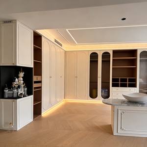 High-End Dreamy Cream Closet - Arch Glass & Ribbed Detail, LED Lights, Playful Display + Workstation for Luxury Family Homes - Product Image 3