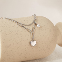 Bracelet multi-couches élégant en acier inoxydable de luxe léger, design ajouré simple avec breloque cœur, pour femme, cadeau bijou