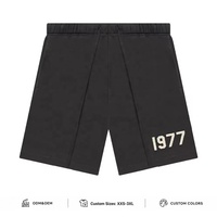 Shorts en coton noir tricoté pour hommes avec taille élastique mi-haute et détail graphique sur le devant pour le streetwear décontracté - Fournisseur en gros