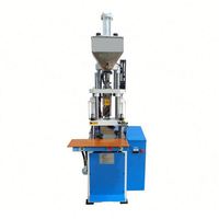 Machine de moulage par injection de plastique de type vertical pour semelles de chaussures