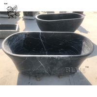 Baignoire autoportante de luxe sur mesure, sculptée à la main en marbre noir naturel massif, pour la décoration des salles de bain de villas et d'hôtels