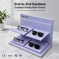 Présentoir à lunettes pliable en acrylique à deux niveaux, couleur lavande, avec 4 plateformes, grand panneau arrière et base stable, pour comptoir optique