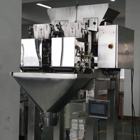 Peseur linéaire entièrement automatique multifonction à 2 têtes remplissant la machine d'emballage alimentaire de particules de boule de chocolat