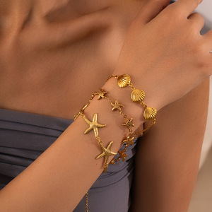 Bracelets SL115 en acier inoxydable 316L plaqué or 18 carats avec breloques étoile de mer et coquillage, résistants au ternissement et imperméables, collection été - Product Image 1