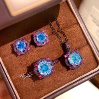 Ensemble de bijoux fantaisie pour femme : Collier pendentif bleu marine à huit points taillés en forme de rose, boucles d'oreilles rondes en cuivre plaqué or noir et bague ouverte - Vente en gros
